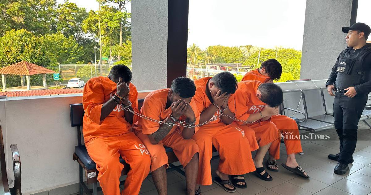 Four men charged over death of businessman found in Johor river