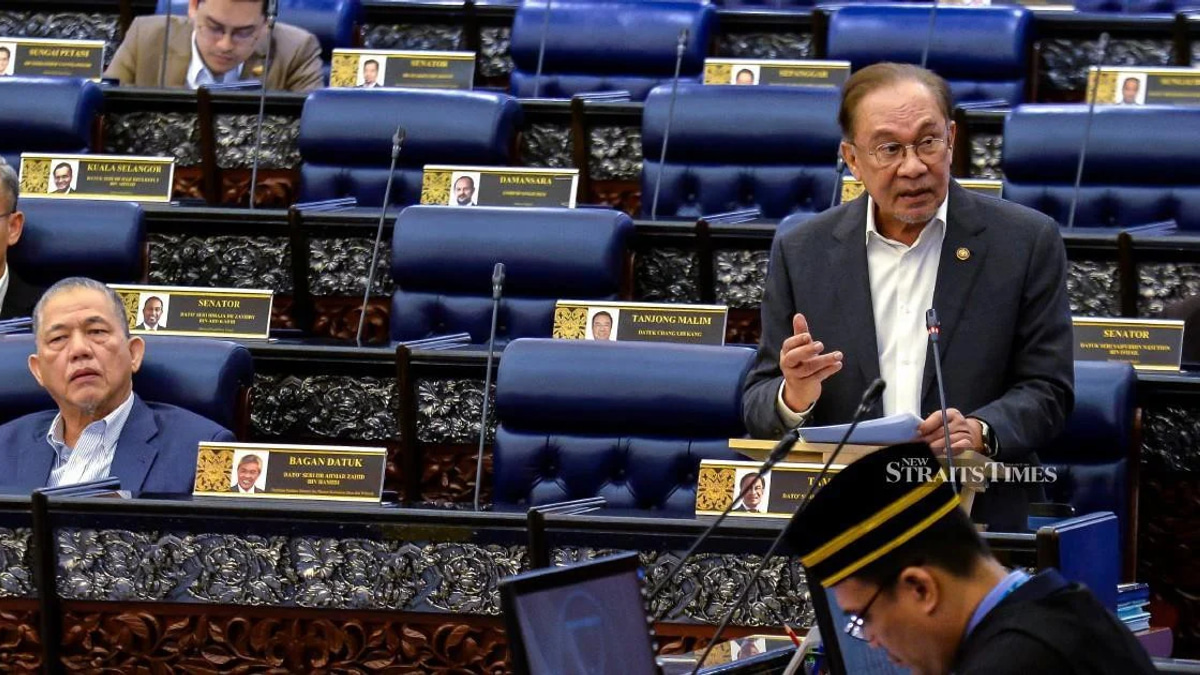 E-wallet firms must refund scam victims if security systems fail, Anwar says