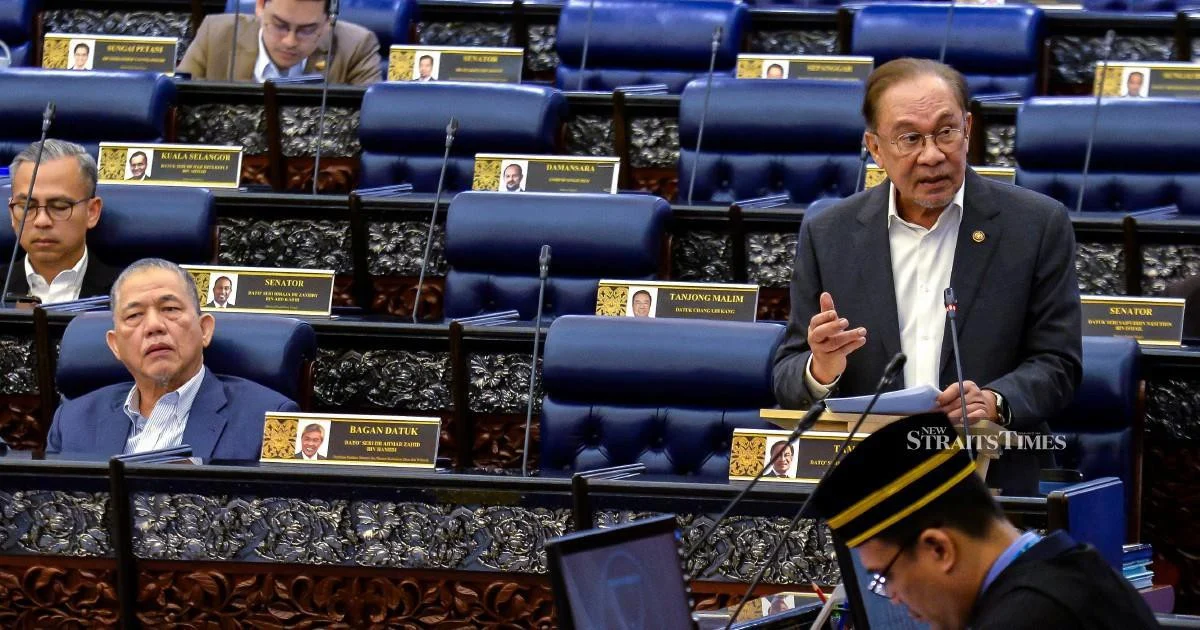 E-wallet firms must refund scam victims if security systems fail, Anwar says