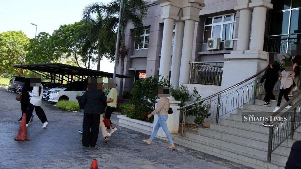 Kelantan Syariah Court Delays Hearing for 14 Men Accused of Cross-Dressing
